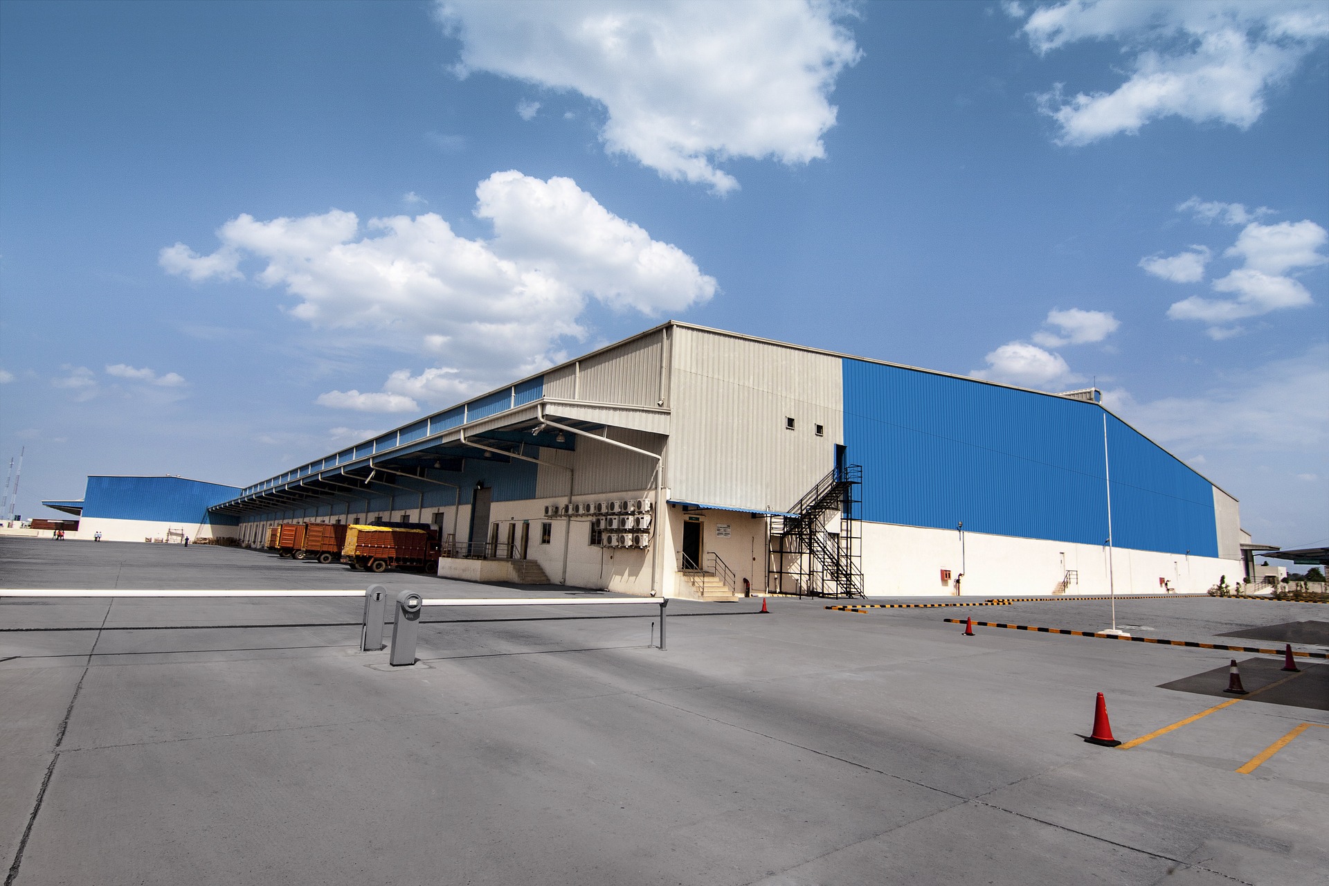 Exterior of a blue and white manufacturing facility.