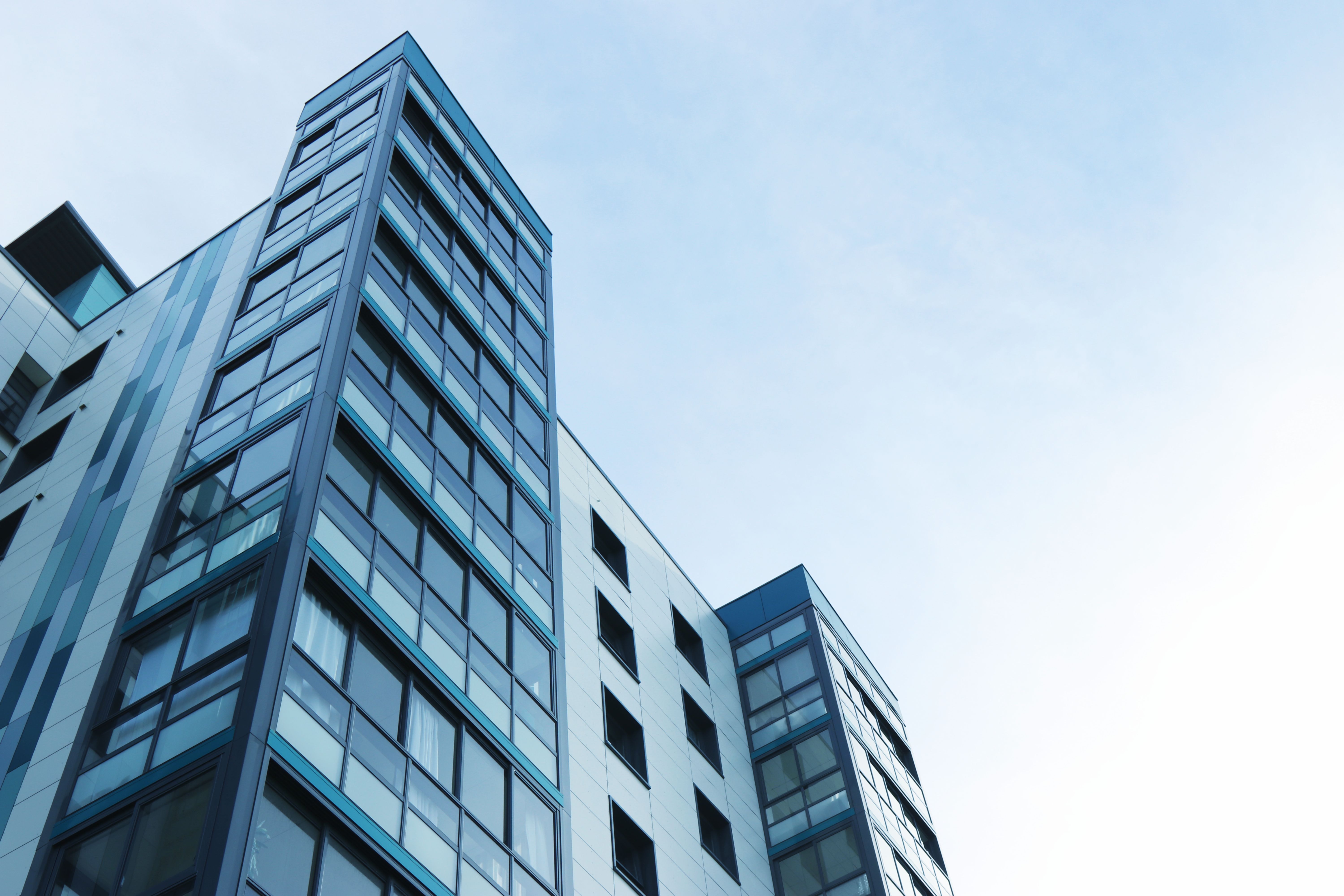 Blue glass and metal industrial looking buildings.