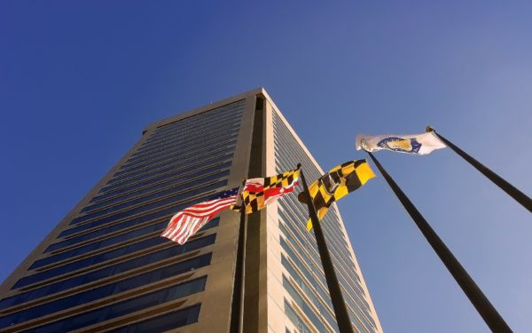 World Trade Center Baltimore with the American, Maryland, Baltimore, and unidentified flag on flagpoles.