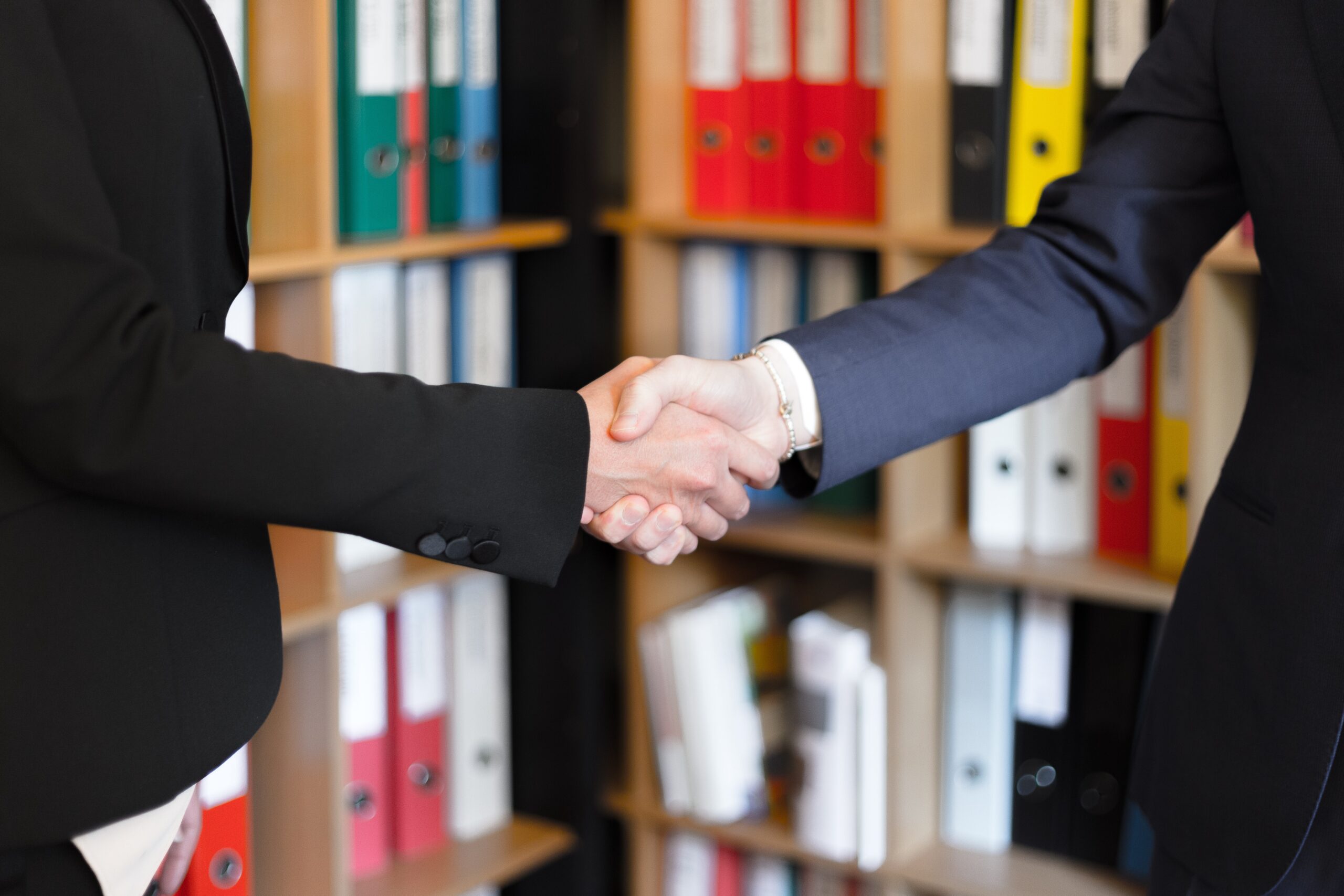 two people shaking hands.