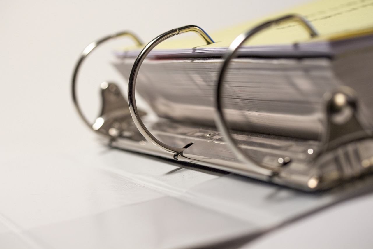 Rings of binder holding paper.