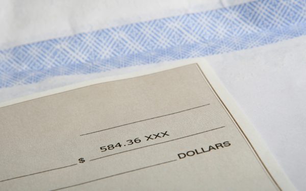 upclose-picture-of-a-paycheck-and-envelope