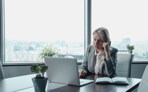 Woman sitting at desk on video call