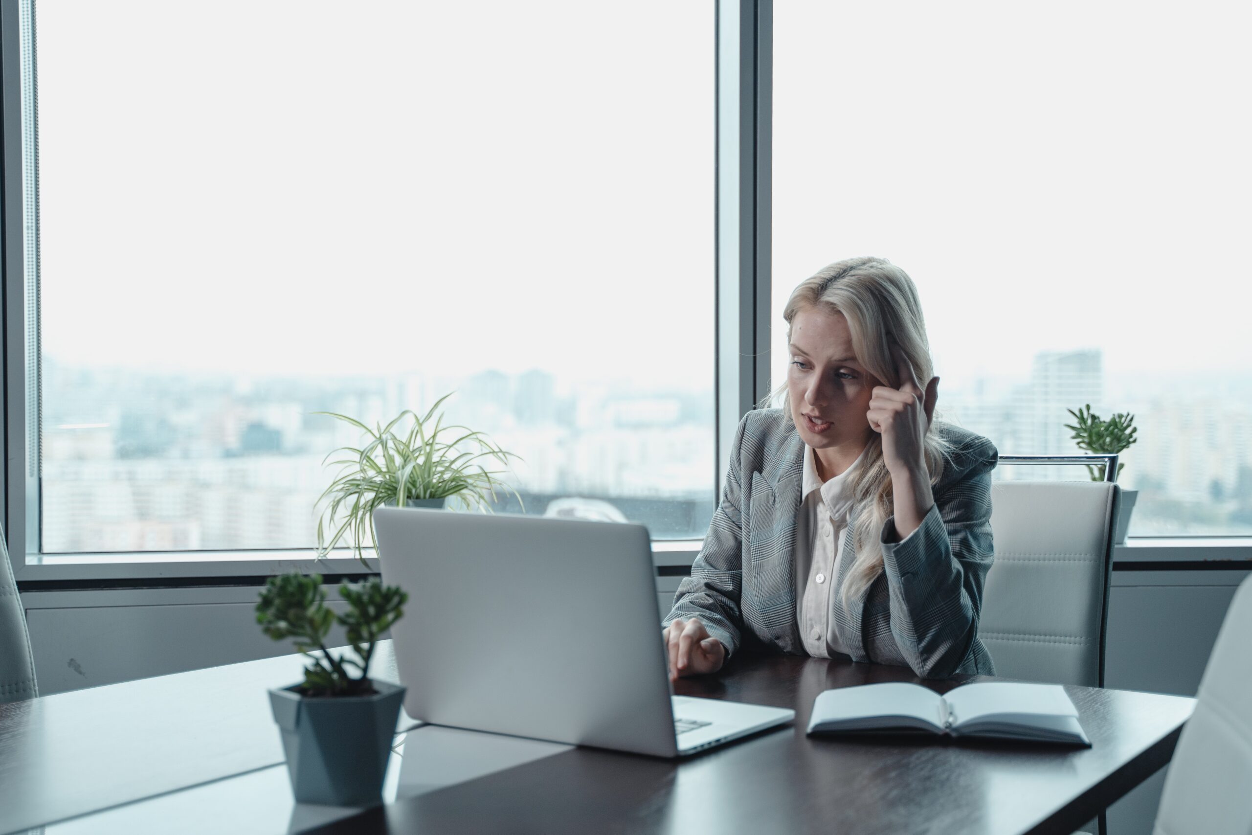 Woman sitting at desk on video call