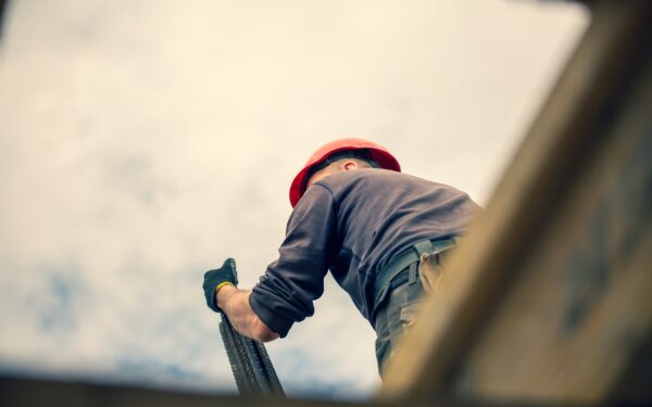 Construction worker on roof.