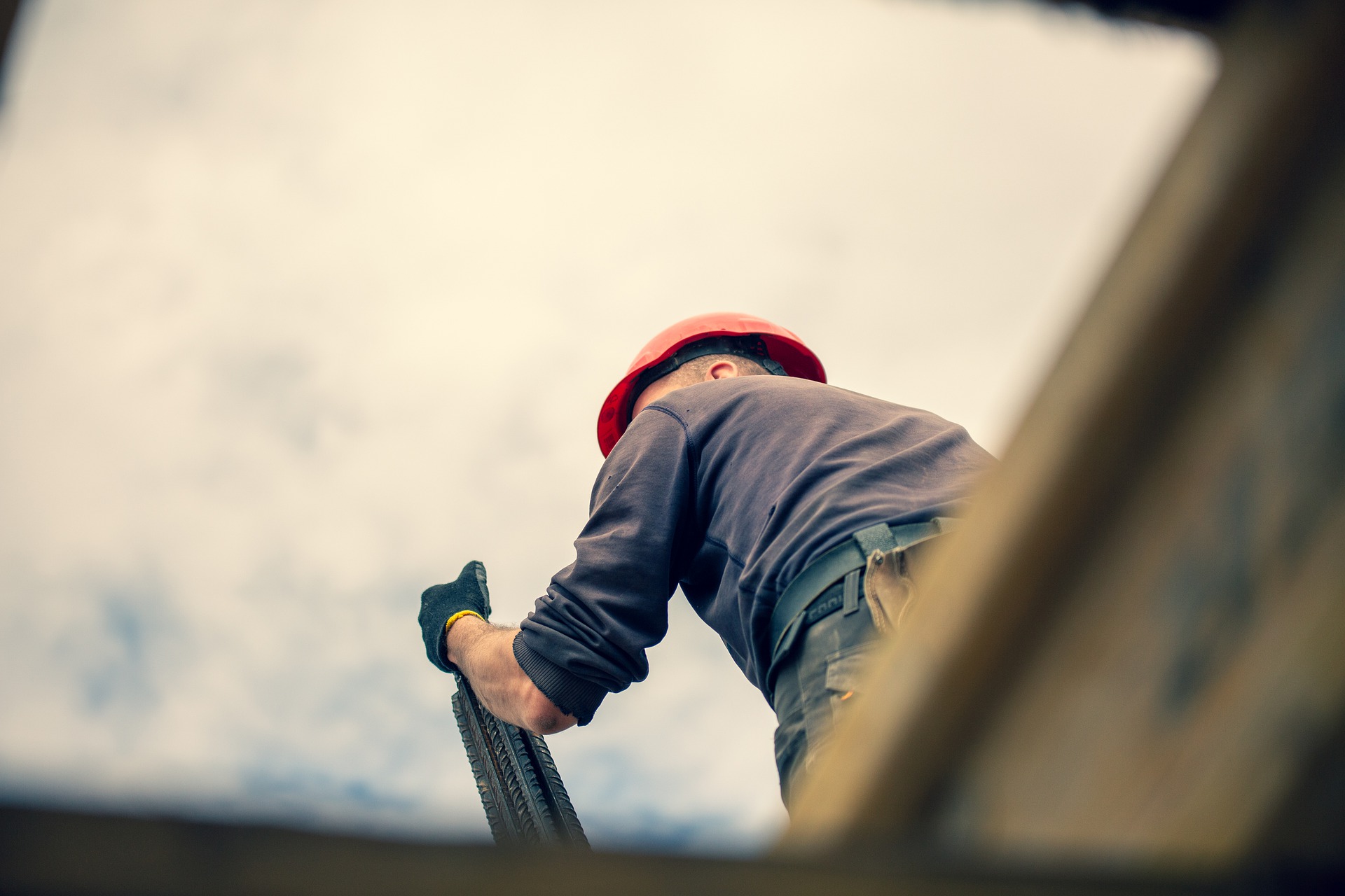 Construction worker on roof.