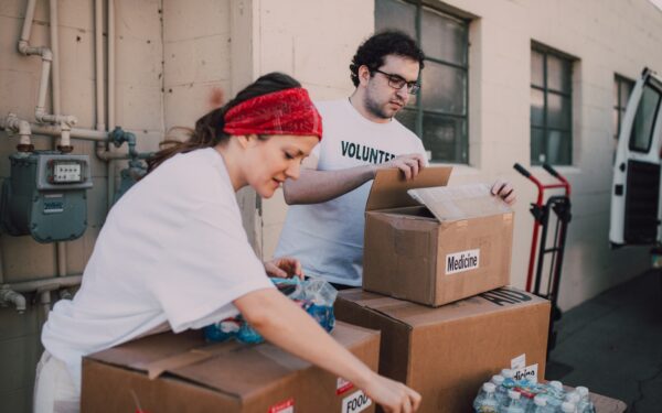 Woman and man volunteering at food bank.