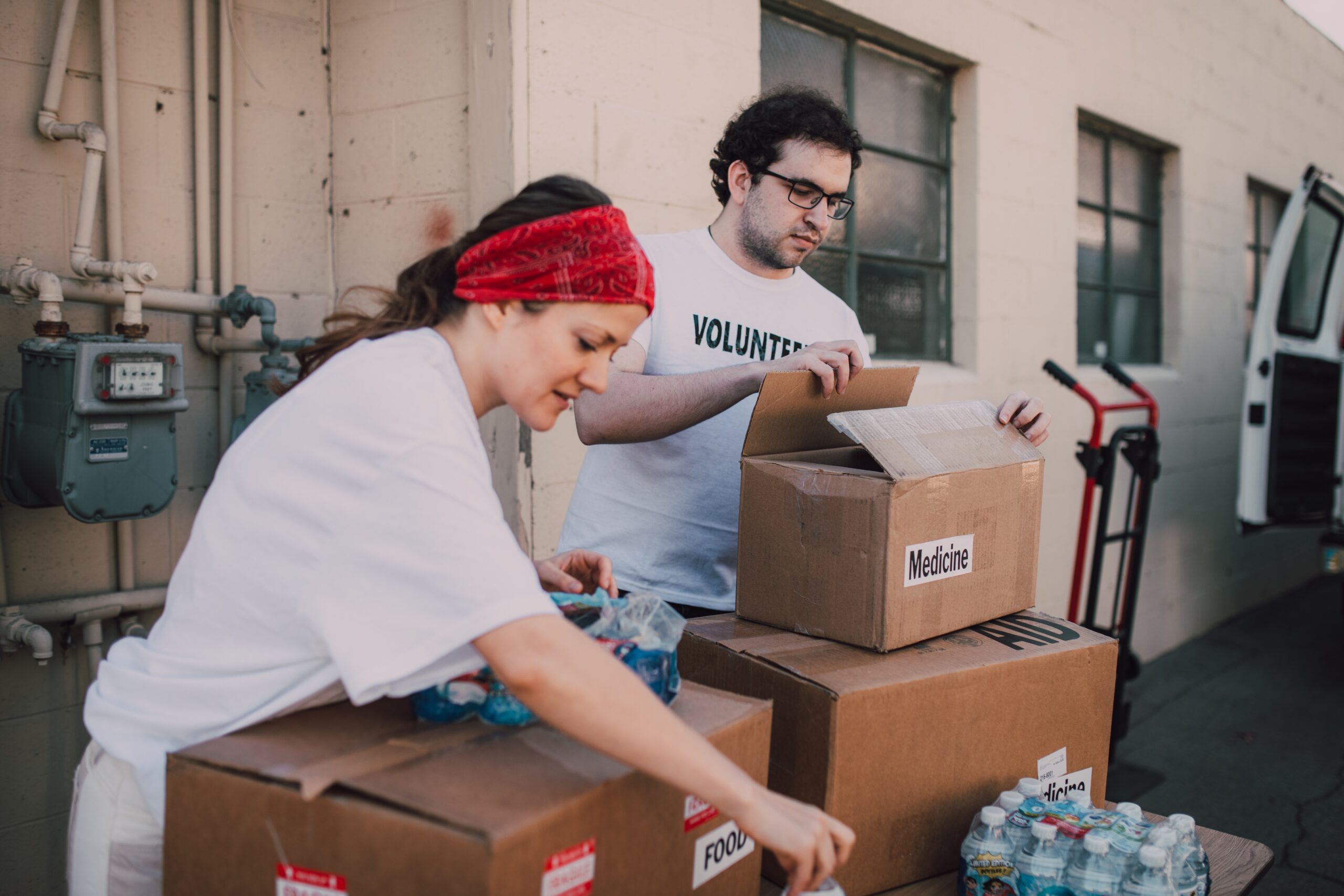 Woman and man volunteering at food bank.