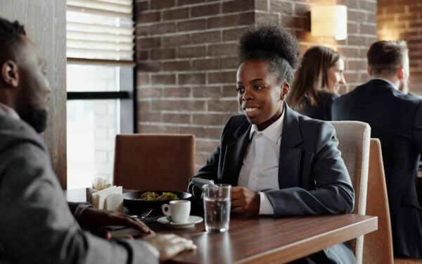 Woman and man having a business lunch at a restaurant.