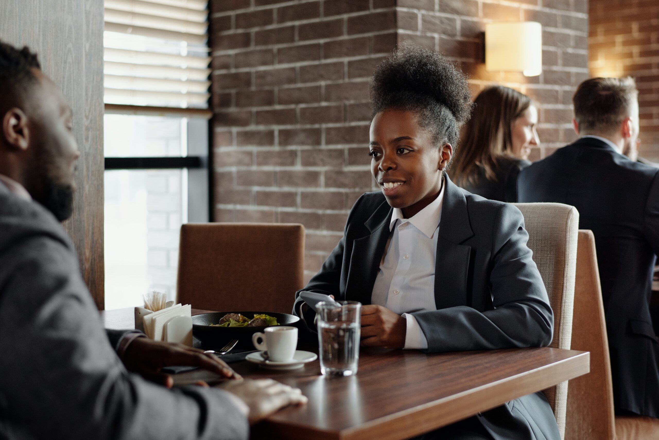 Woman and man having a business lunch at a restaurant.