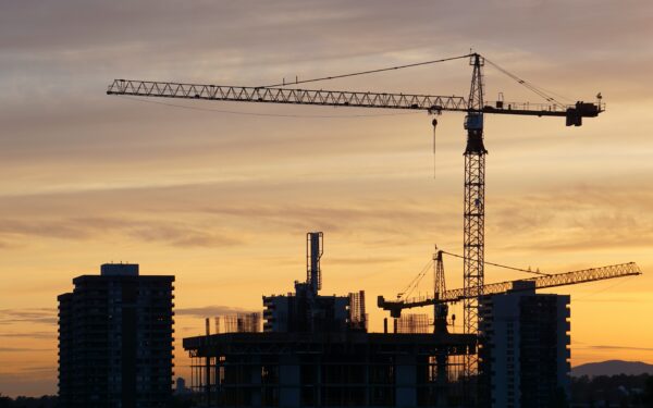 silhouette of construction site at sunset