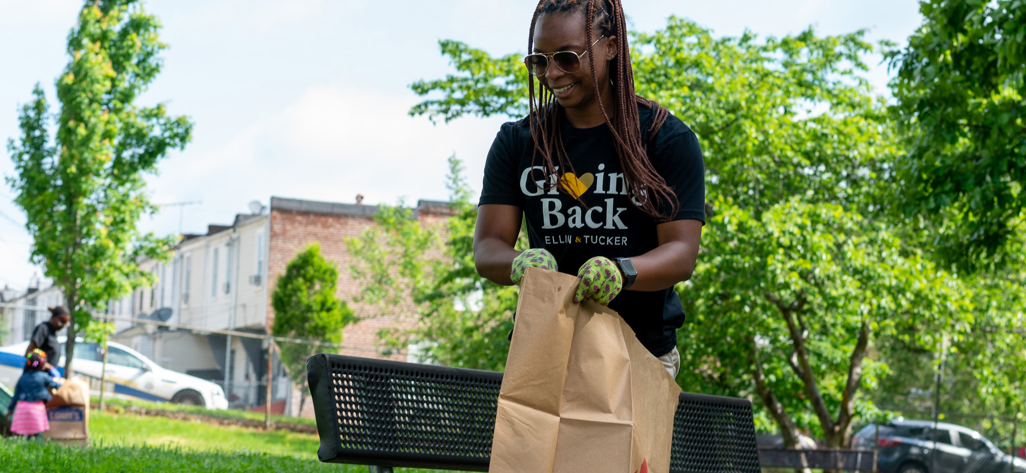 Ellin & Tucker employee cleaning up a Baltimore neighborhood park.