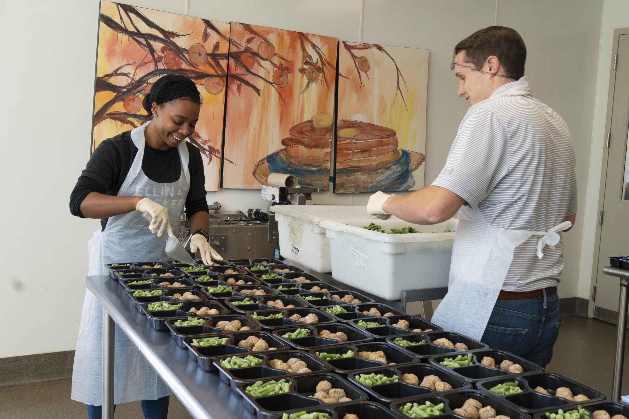 Ellin & Tucker employees volunteering making meals at Moveable Feast.