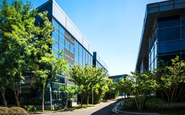 exterior of small office building with tree lined sidewalks