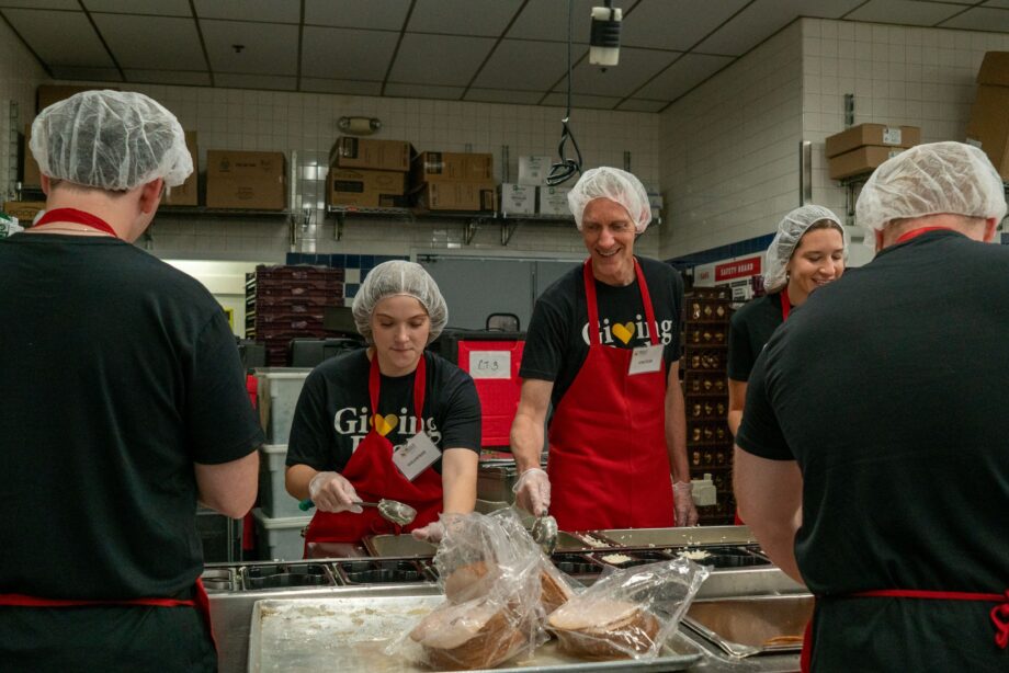 Mia Applegate and David Schriver packaging meals at Meals on Wheels of Central Maryland
