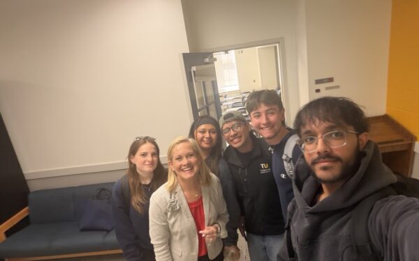 Ellin & Tucker CEO Aileen Eskildsen poses with accounting students at Towson University